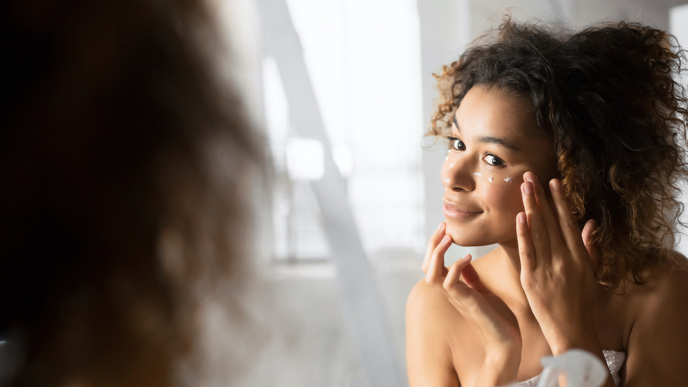 woman applying eye cream