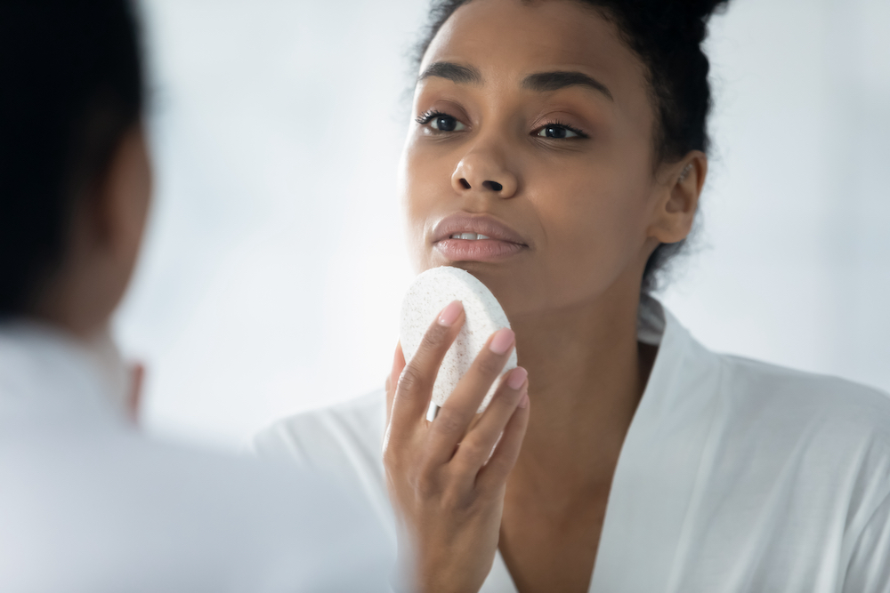 woman cleaning face